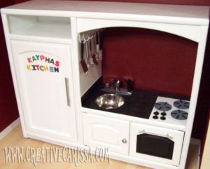 Entertainment center converted into play kitchen